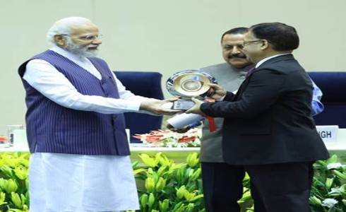 PM Modi awarding health secretary Rajesh Bhushan